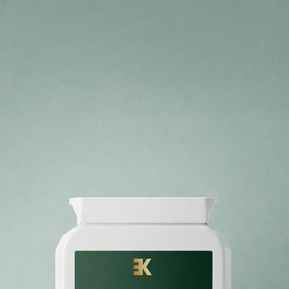 supplement bottle container with brand Eonkind on a light green background